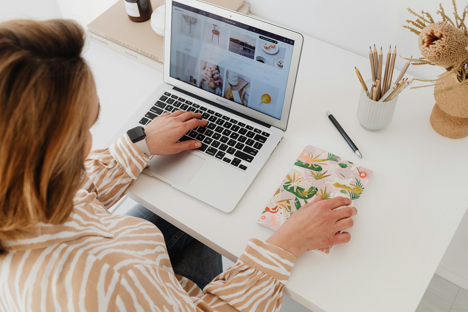 a woman working on a laptop