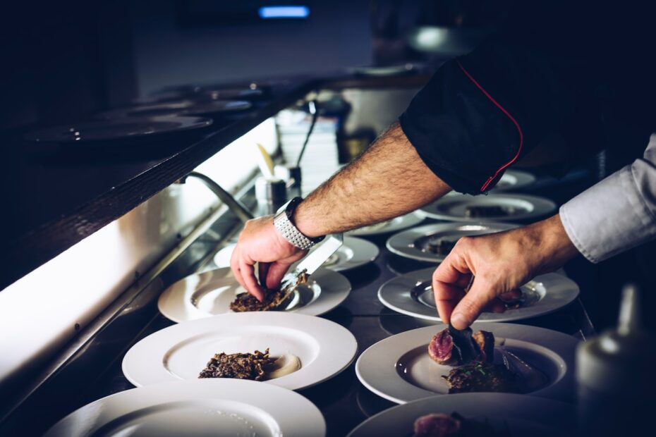 person preparing cooked dish