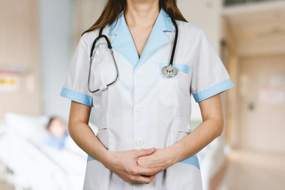 woman in white button up shirt and blue stethoscope