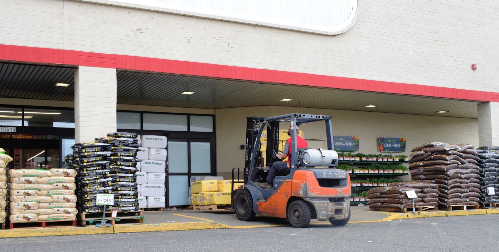 a forklift parked in front of a store