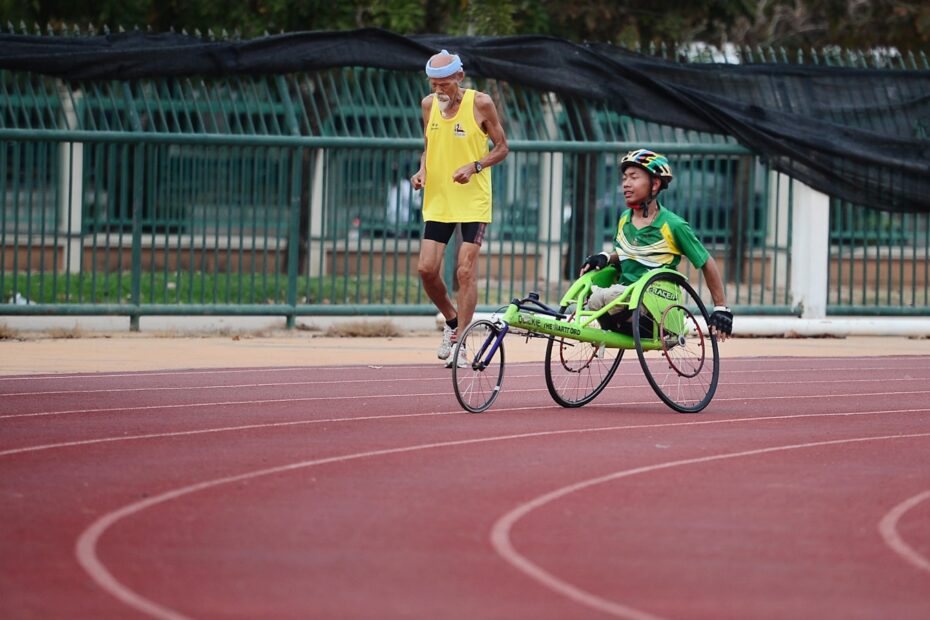 man using green wheelchair for walking